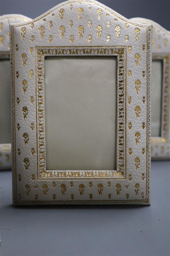 Six embossed leather frames, c.1920, height 16.5cm